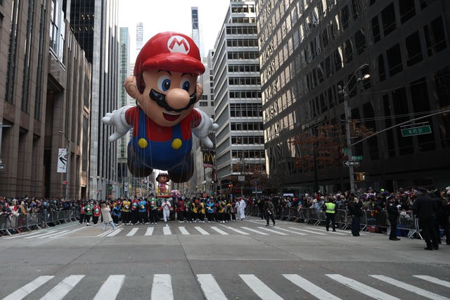 The Super Mario balloon makes its way down Sixth Avenue during the Macy’s Thanksgiving Day Parade in New York