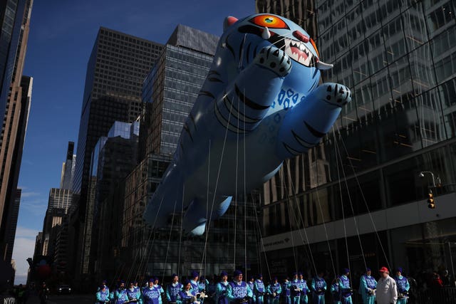 The KPop Demon Hunters balloon makes its way down Sixth Avenue during the Macy’s Thanksgiving Day Parade in New York