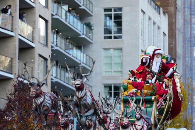 Macy’s Santa Claus reacts as he rides on Santa’s Sleigh during the Macy’s Thanksgiving Day Parade in New York