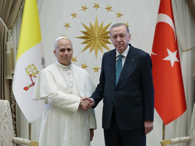 Tayyip Erdogan shaking hands with Pope Leo