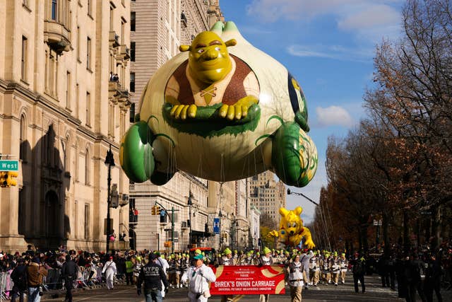 The Shrek’s Onion Carriage balloon floats down Central Park West during the Macy’s Thanksgiving Day Parade in New York