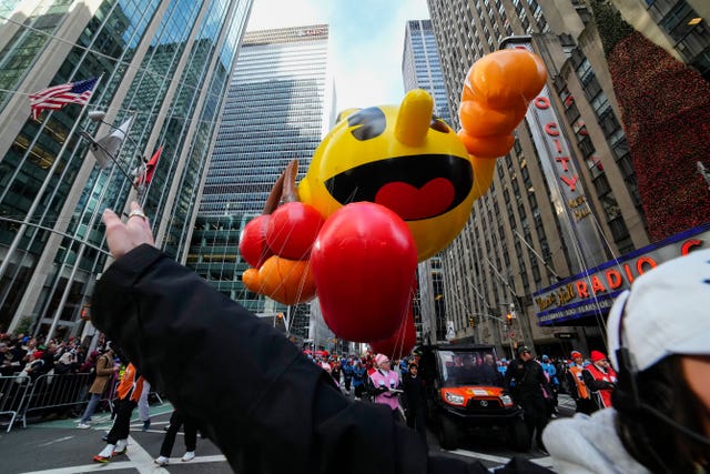 The Pac-Man balloon floats down Sixth Avenue during the Macy’s Thanksgiving Day Parade in New York
