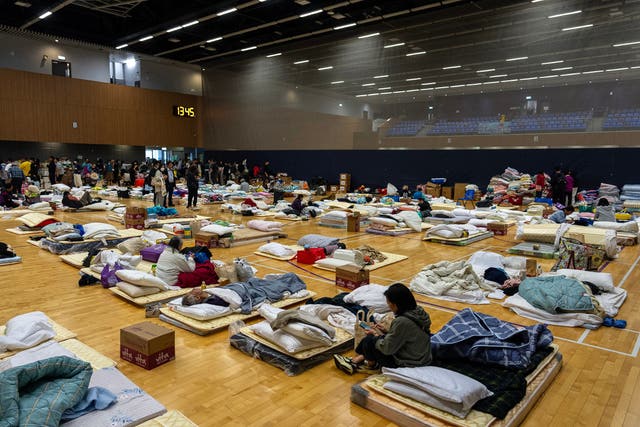 Residents resting at a temporary shelter in Hong Kong