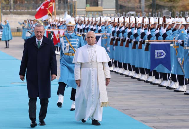 The Pope and President Recep Tayyip Erdogan review an honour guard at the presidential palace in Ankara