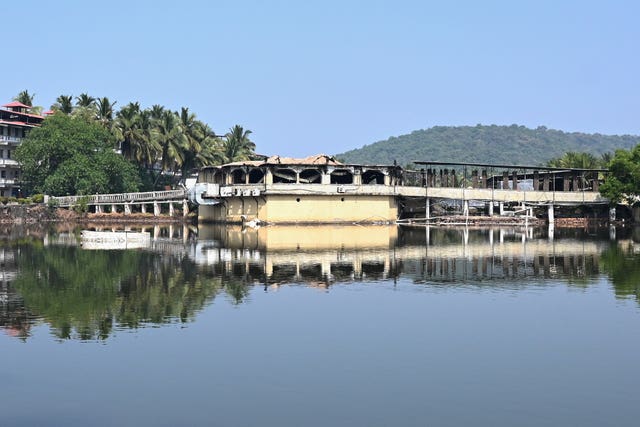 The nightclub is seen across an expanse of water