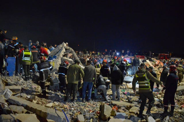 Rescue workers search for survivors after two buildings collapsed in Fez