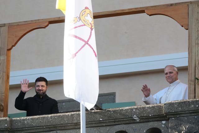 Ukraine’s president Volodymyr Zelensky and Pope Leo waving