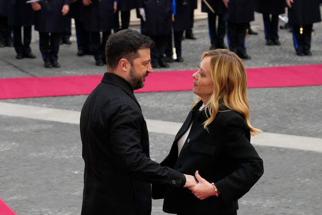 Ukraine’s president Volodymyr Zelensky, left, being received by Italian premier Giorgia Meloni