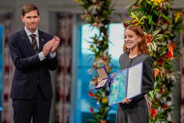 The daughter of the Nobel Peace Prize laureate, Ana Corina Sosa, accepts the award on behalf of her mother