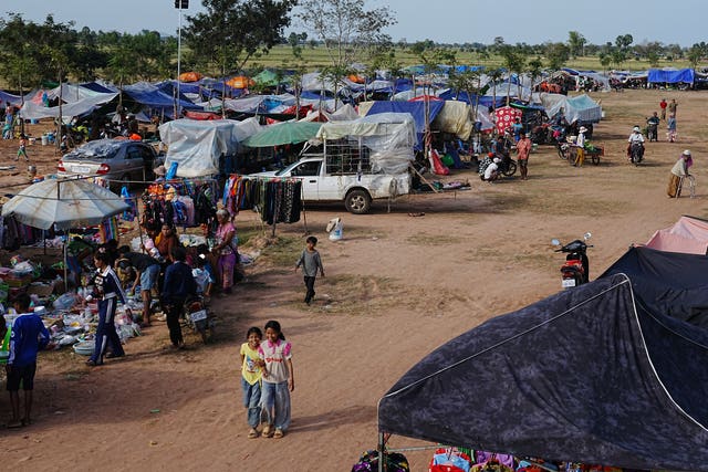 People take refuge in Wat Prasat Srahkandal, Banteay Menchey province, Cambodia after fleeing their homes after fighting along the Thailand-Cambodia border