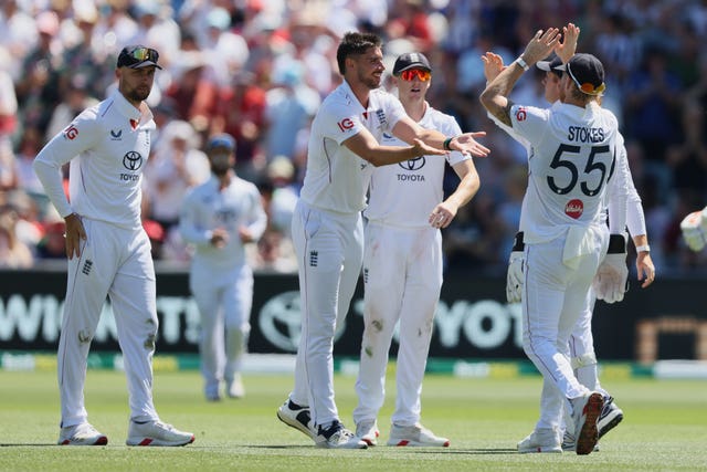 England’s Josh Tongue, centre, is congratulated by team-mates after dismissing Australia’s Josh Inglis