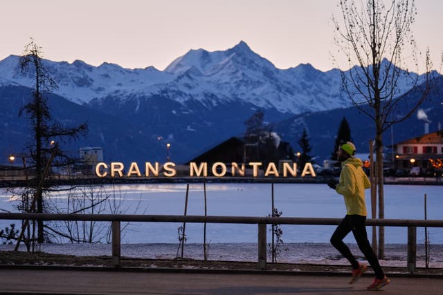 A man running in the early morning in Crans-Montana, Swiss Alps