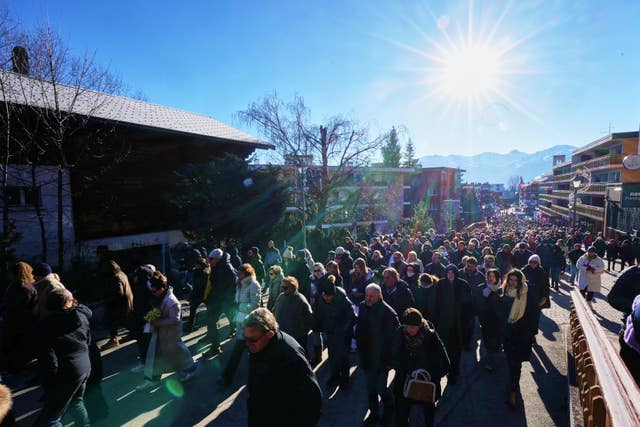 Large group of people walking outside
