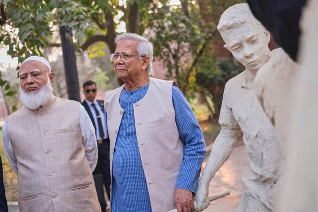 Head of Bangladesh’s interim government Muhammad Yunus, centre, with Bangladesh Jamaat-e-Islami party leader Ameer Shafiqur Rahman