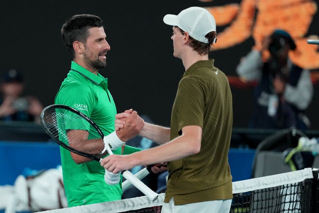 Novak Djokovic, left, shakes hands with Jannik Sinner