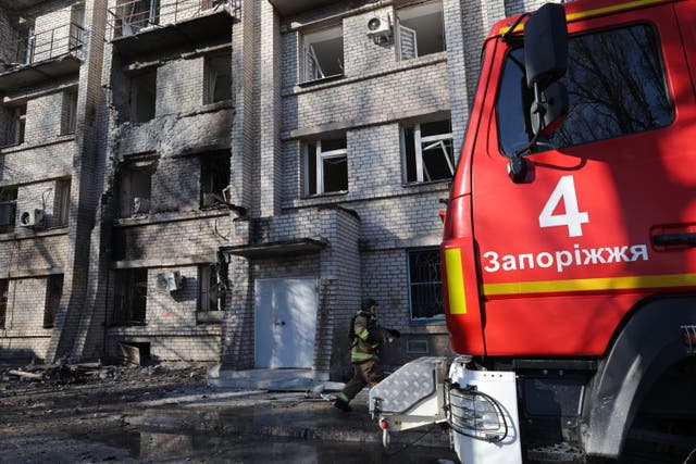 Emergency services at the site of a Russian drone attack on a city maternity hospital in Zaporizhzhia