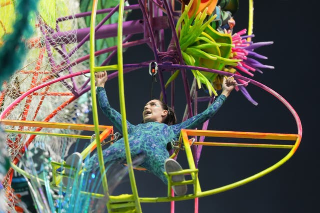 A dancer from the Mocidade Unida da Mooca samba school performs on a float