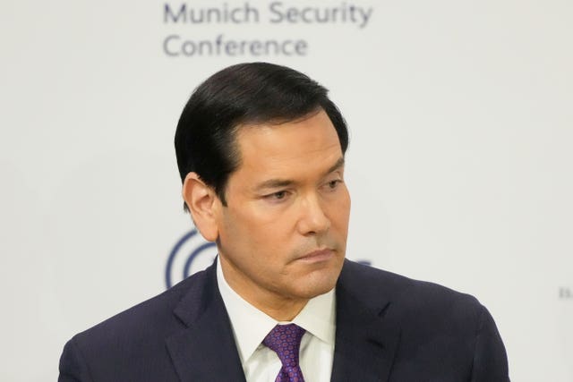 Headshot of Marco Rubio in front of Munich Security Conference signage
