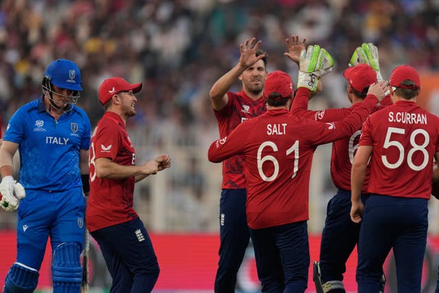 Jamie Overton, centre, celebrates taking a wicket