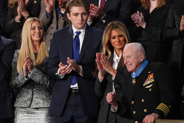 First lady Melania Trump applauds after presenting the Congressional Medal of Honour to Second World War Navy pilot Capt Royce Williams