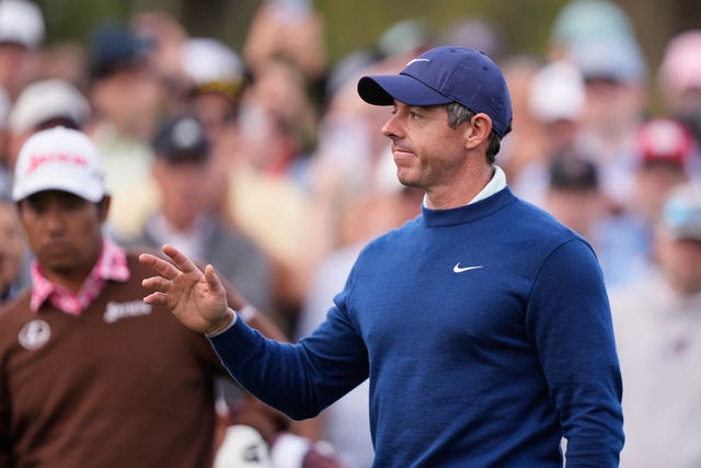 Rory McIlroy acknowledges fans applause before hitting off the 10th tee
