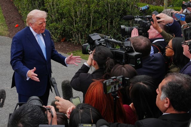 President Donald Trump speaks with reporters before leaving the White House on Friday