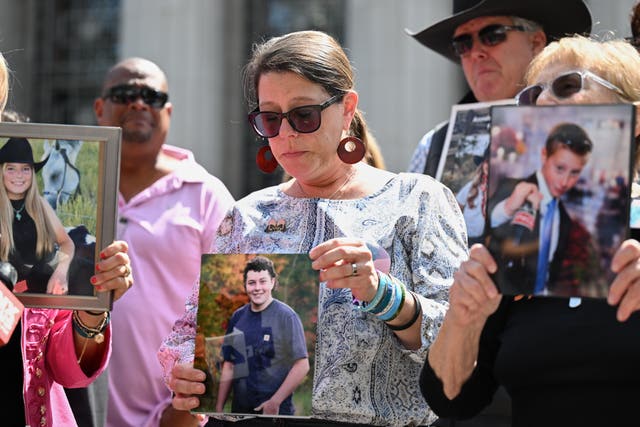 Mary Rodee holds a photo of her son Riley after the verdict in the landmark trial over whether social media platforms deliberately addict and harm children at Los Angeles Superior Court
