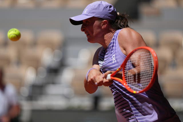 Iga Swiatek hits a backhand