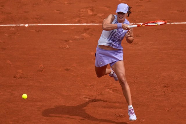 Iga Swiatek hits a forehand
