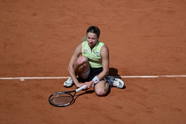 Maja Chwalinska crouches on the clay