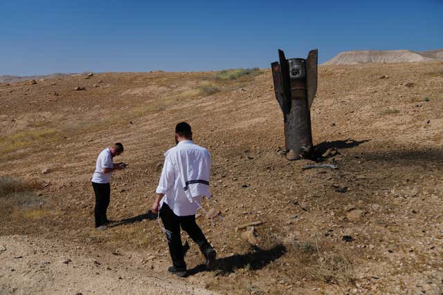 Israel and Iran exchange strikes after Beirut attack, in photos