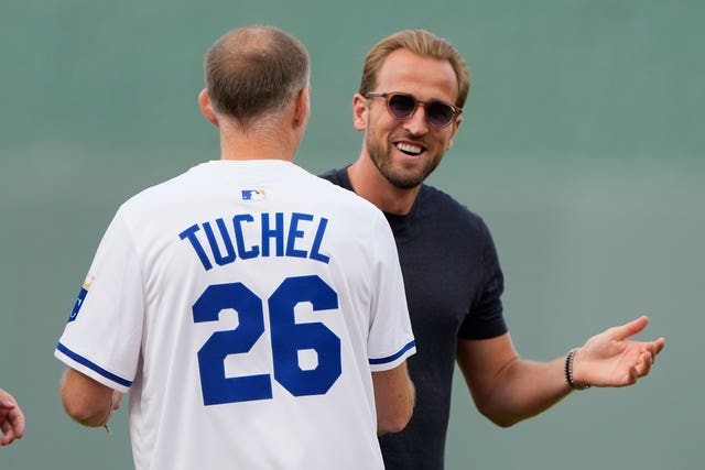 Harry Kane, right, congratulates Tuchel after the pitch
