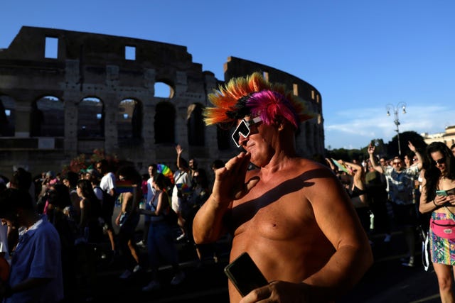 Pride marchers outside the Colosseum