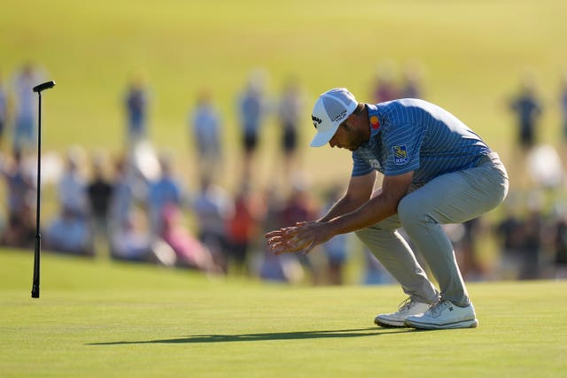 Sam Burns reacts after missing a putt