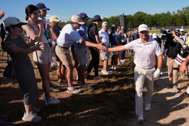 Wyndham Clark greets fans during the final round of the U.S. Open