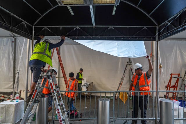 Workers set up a tent outside Madison Square Garden ahead of the reported wedding between Taylor Swift and Travis Kelce