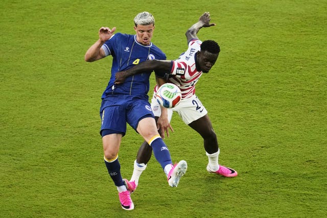United States’ Folarin Balogun, right, fouls Bosnia’s Tarik Muharemovic