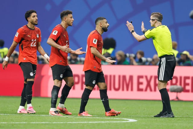 Egypt’s Mohamed Salah (10) talks with referee Francois Letexier during the game against Argentina