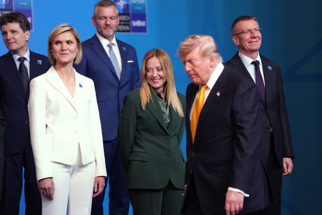 US President Donald Trump, second right, arrives for a group photo during the Nato summit in Turkey