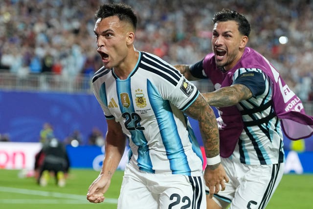 Argentina’s Lautaro Martinez (22) and Leandro Paredes celebrate