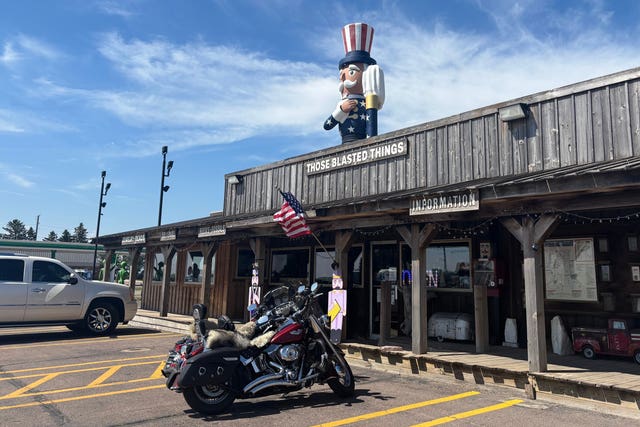 Verne the Patriot rises behind the shop Those Blasted Things in Luverne, Minnesota
