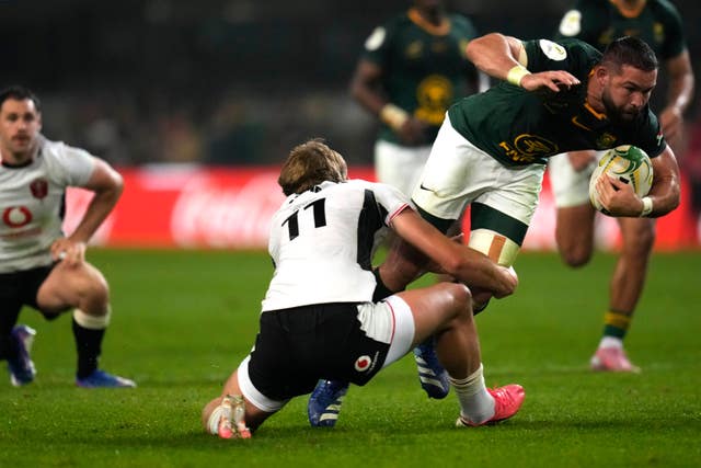 Cobus Reinach, right, is tackled by Ellis Mee
