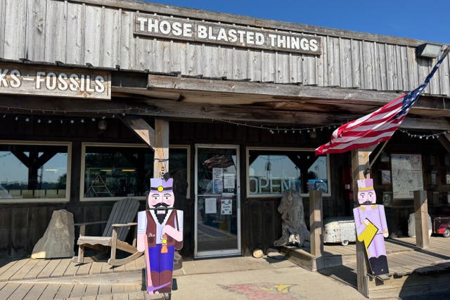 A flag flies in front of Those Blasted Things, a quirky shop right off the interstate in Luverne, Minnesota