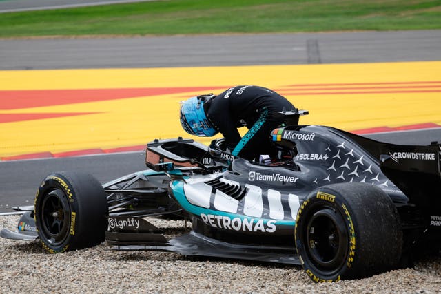 George Russell of Britain gets out of his Mercedes after going off the track in Belgium