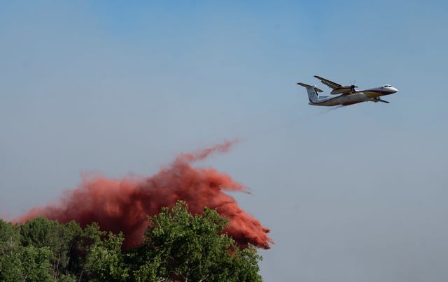 A water bomber fighting wildfires In Ares, western France