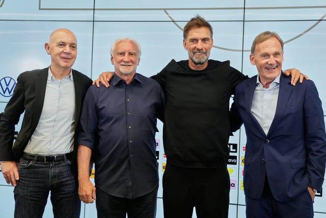 Jurgen Klopp with DFB President Bernd Neuendorf, left, DFB mens national team sporting director Rudi Voeller, centre left, and vice-president Hans-Joachim Watzke, right