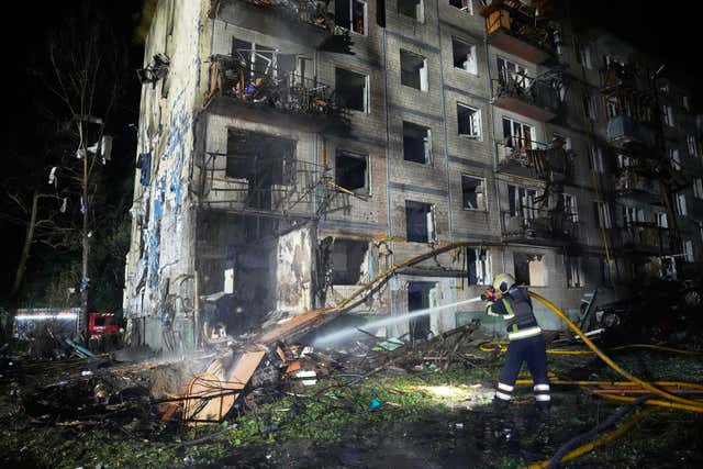 Emergency services work to extinguish a fire