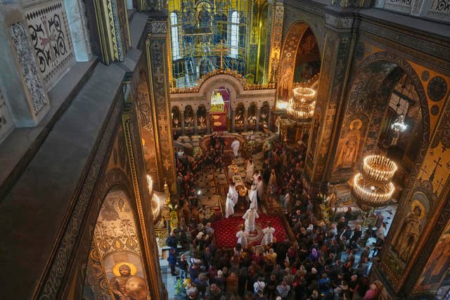 A funeral is held at a cathedral
