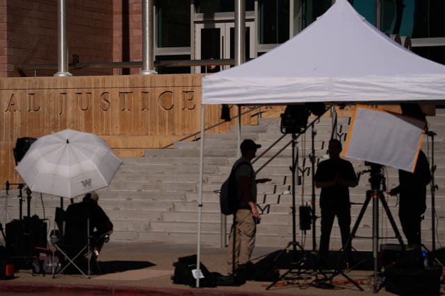 Members of the media stand in front of the Regional Justice Centre ahead of opening statements in the murder trial of Duane Davis in Las Vegas