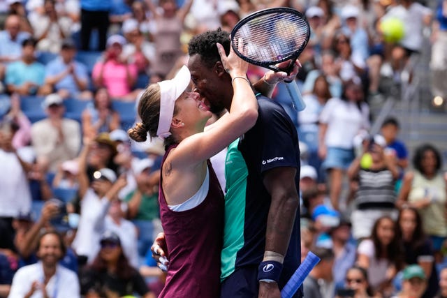 Elina Svitolina, left, and Gael Monfils kiss after their opening win